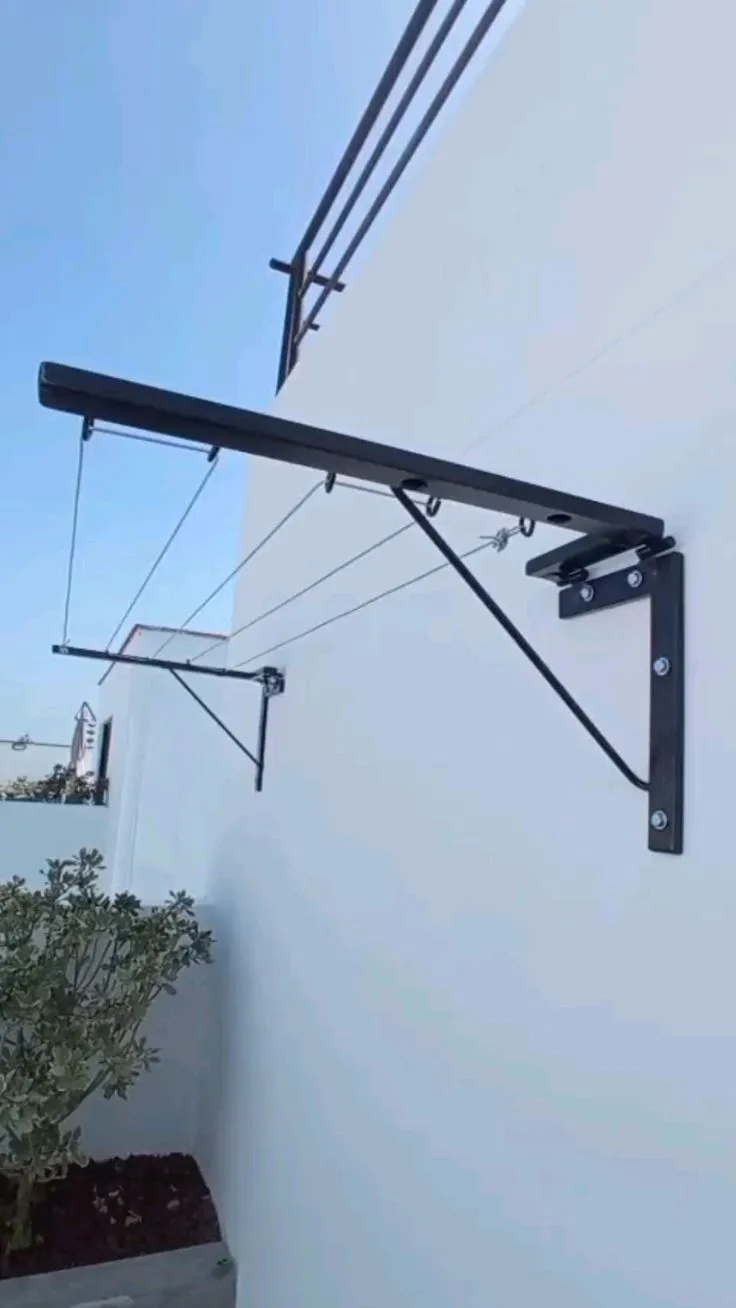Tendedero abatible de herrería instalado en muro exterior – tendederos plegables por mayoreo en Guadalajara